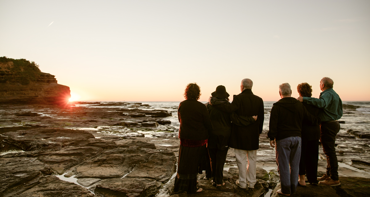 group of people at farewell on beach