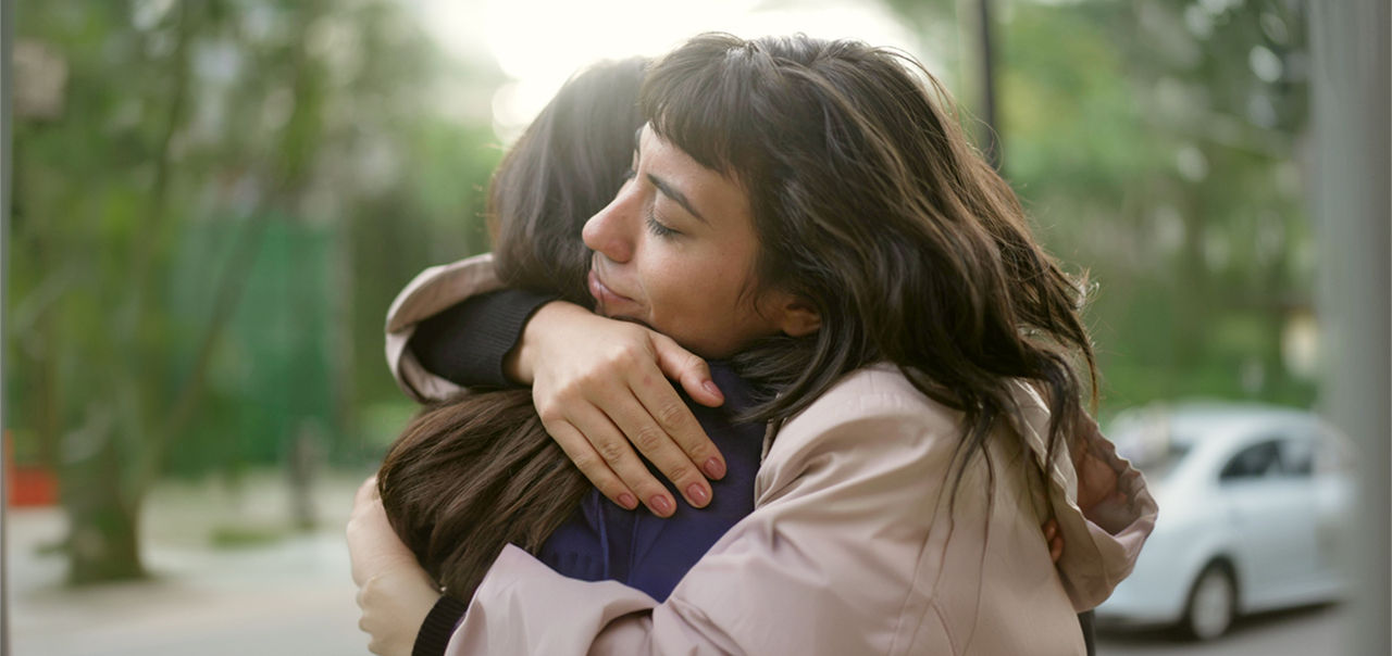 women hugging